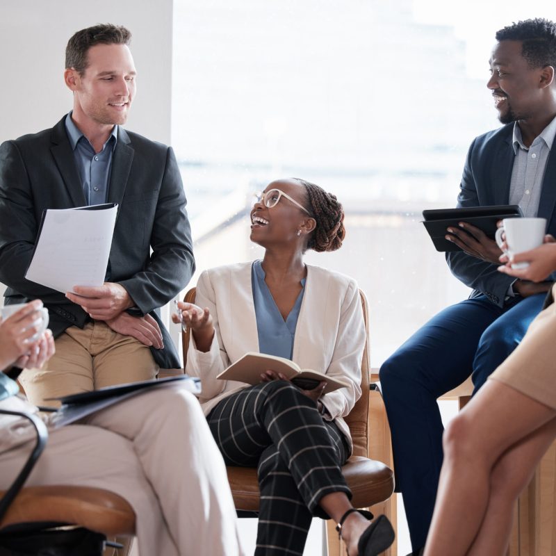 Would you like to say something. Shot of a group of businesspeople in a meeting at work